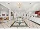 Elegant lobby featuring stylish decor, a grand chandelier, and a welcoming reception area at 7383 Universal Blvd # 207, Orlando, FL 32819
