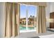 Bedroom window view of a resort-style pool at 7383 Universal Blvd # 207, Orlando, FL 32819