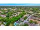 Aerial view of the community with mature trees, pool, and convenient parking at 7615 Bay Port Rd # 36, Orlando, FL 32819