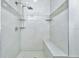 Bathroom with shower, built-in seat and marble flooring at 7615 Bay Port Rd # 36, Orlando, FL 32819