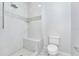 Bathroom with shower, built-in seat and marble flooring at 7615 Bay Port Rd # 36, Orlando, FL 32819