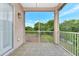 Screened porch overlooking a backyard with trees and greenery at 7615 Bay Port Rd # 36, Orlando, FL 32819