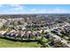 Aerial view showing a house location in a community with many homes and pools at 7654 Wilmington Loop, Kissimmee, FL 34747