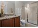 Bathroom with granite vanity, shower and toilet at 7654 Wilmington Loop, Kissimmee, FL 34747