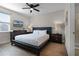 Comfortable bedroom with a king-size bed and en-suite bathroom access at 7654 Wilmington Loop, Kissimmee, FL 34747