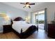 Bedroom with king-size bed and patio access at 7654 Wilmington Loop, Kissimmee, FL 34747