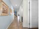 Bright hallway with light walls and art at 7654 Wilmington Loop, Kissimmee, FL 34747