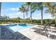 Relaxing pool area with patio and lounge chairs at 7654 Wilmington Loop, Kissimmee, FL 34747