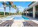 Refreshing pool with spa and patio furniture at 7654 Wilmington Loop, Kissimmee, FL 34747