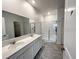 Double vanity bathroom with a large walk-in shower at 807 Ofanto Way, Haines City, FL 33844