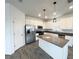 Modern kitchen with stainless steel appliances and island at 807 Ofanto Way, Haines City, FL 33844