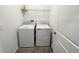 Laundry room with washer, dryer, and shelving at 807 Ofanto Way, Haines City, FL 33844