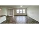 Bright and airy living room with wood-look floors at 807 Ofanto Way, Haines City, FL 33844