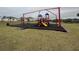 Community playground with playset and swings at 807 Ofanto Way, Haines City, FL 33844