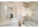 Modern bathroom includes a bathtub, vanity, and large mirror at 8558 Morehouse Dr, Orlando, FL 32836