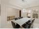 Modern dining room with a large table, chandelier, and hardwood floors at 8558 Morehouse Dr, Orlando, FL 32836