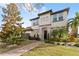 Two-story house with a three-car garage, walkway, and landscaping at 8558 Morehouse Dr, Orlando, FL 32836