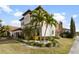 Two-story house with Mediterranean style and landscaping at 8558 Morehouse Dr, Orlando, FL 32836