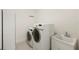 Functional laundry room with washer, dryer, and utility sink at 8558 Morehouse Dr, Orlando, FL 32836