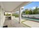 Modern outdoor kitchen with built-in grill and pool view at 8558 Morehouse Dr, Orlando, FL 32836