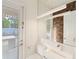 Modern powder room with floating vanity and wood feature wall at 8558 Morehouse Dr, Orlando, FL 32836