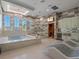 Spa-like bathroom with soaking tub, sauna, and shower at 900 Jack Nicklaus Ct, Kissimmee, FL 34747