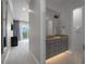 Modern bathroom with gray vanity and under-cabinet lighting at 900 Jack Nicklaus Ct, Kissimmee, FL 34747