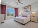 Spacious bedroom with large bed, plenty of light, and stylish decor at 900 Jack Nicklaus Ct, Kissimmee, FL 34747