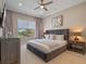 Spacious bedroom with a large bed and window at 900 Jack Nicklaus Ct, Kissimmee, FL 34747