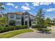 Two-story home with stone accents and manicured landscaping at 900 Jack Nicklaus Ct, Kissimmee, FL 34747