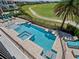 Luxury pool with spa and lounge area, overlooking golf course at 900 Jack Nicklaus Ct, Kissimmee, FL 34747