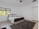 Bright bedroom with a plush bed and large window at 9138 Great Heron Cir, Orlando, FL 32836