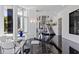 Bright dining area with glass table and modern chairs near the kitchen at 9138 Great Heron Cir, Orlando, FL 32836