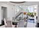 Modern dining room with a round glass table and gray chairs at 9138 Great Heron Cir, Orlando, FL 32836