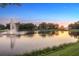 Beautiful lakefront property with fountain and peaceful sunset view at 9138 Great Heron Cir, Orlando, FL 32836