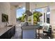 Outdoor kitchen with stainless steel appliances and bar seating at 9138 Great Heron Cir, Orlando, FL 32836