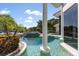 Luxury pool with spa and lake view at 9138 Great Heron Cir, Orlando, FL 32836