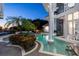 Luxury pool area with spa and fire feature at dusk at 9138 Great Heron Cir, Orlando, FL 32836