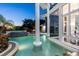 Stunning pool and spa with water features at dusk at 9138 Great Heron Cir, Orlando, FL 32836