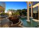 Relaxing pool and patio area with a hot tub and lounge chairs at 9138 Great Heron Cir, Orlando, FL 32836