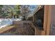 Backyard with gravel, a wooden gate, and a partial view of a patio at 9913 Janette Ln, Clermont, FL 34711