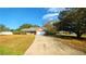 Cute one-story house with a large yard and driveway at 9913 Janette Ln, Clermont, FL 34711