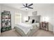 Bedroom with a gray upholstered bed and built-in shelving at 1058 Silas St, Haines City, FL 33844