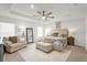 Spacious bedroom with large bed, seating area and a ceiling fan at 1058 Silas St, Haines City, FL 33844