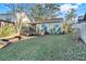 Backyard with a wooden deck and steps down to a grassy area at 1163 Saddleback Ridge Rd, Apopka, FL 32703