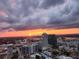 Sunset aerial view of a city skyline, showcasing the beautiful colors of the sunset at 150 E Robinson St # 3104, Orlando, FL 32801