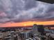 Sunset aerial view of a city skyline, showcasing the beautiful colors of the sunset at 150 E Robinson St # 3104, Orlando, FL 32801