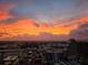 Orange and yellow sunset over a sprawling cityscape at 150 E Robinson St # 3104, Orlando, FL 32801