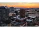 Stunning sunset view over cityscape with various buildings at 150 E Robinson St # 3104, Orlando, FL 32801