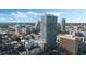 Aerial view of a modern highrise building in a city, showcasing its architecture and urban setting at 150 E Robinson St # 3104, Orlando, FL 32801